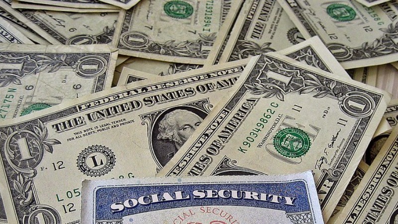 Social Security Card - A social security card on a bed of money I am the designer for  I  have put all these images in the public domain and welcome anyone to use them however please credit our site as the source if you do: , tags: trump's security's - 401(K) 2013 via Flickr